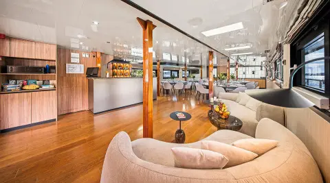 Karizma yacht saloon deck interior with seating area and wood accents
