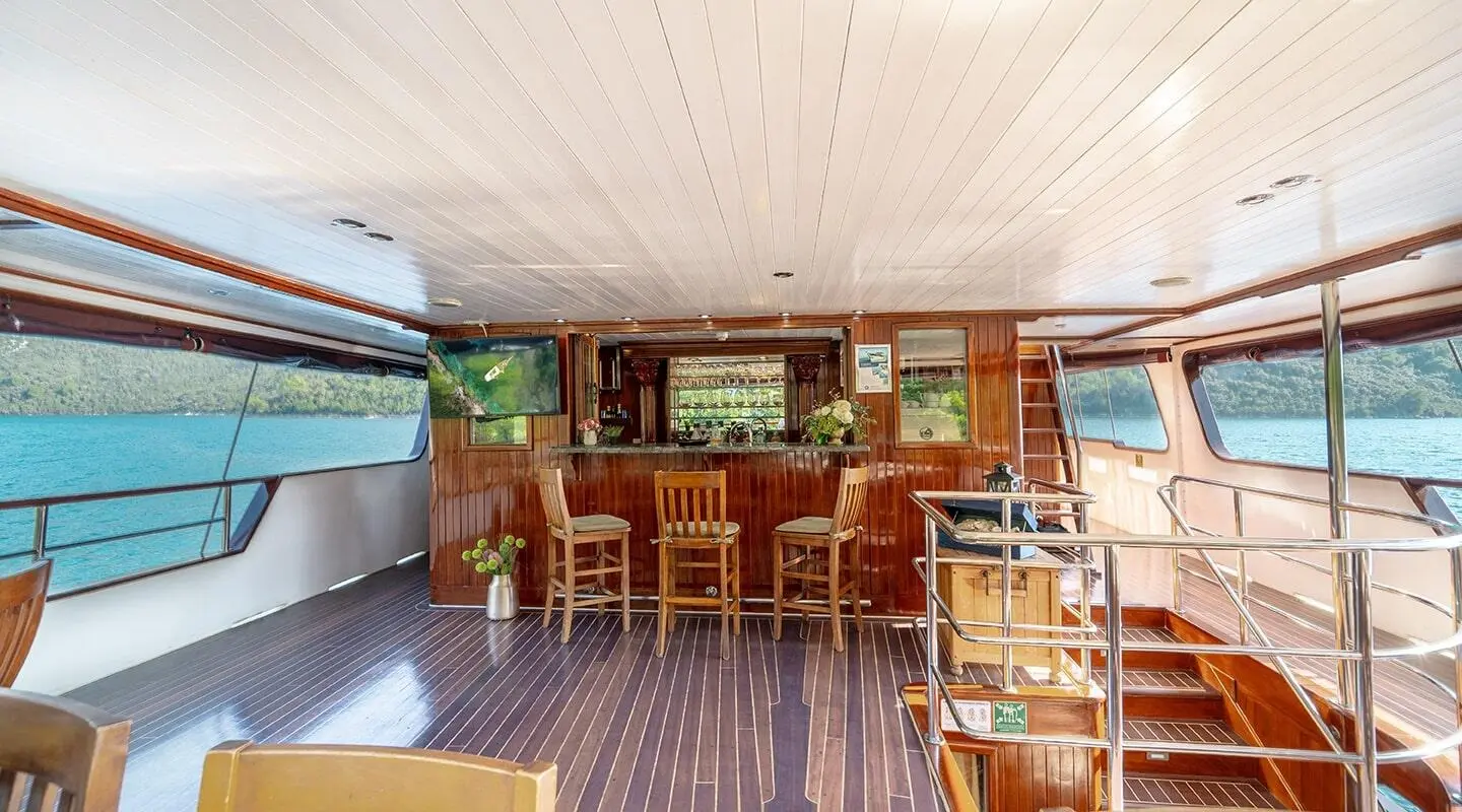 Cesarica gulet aft deck bar with wood interior and open sea view