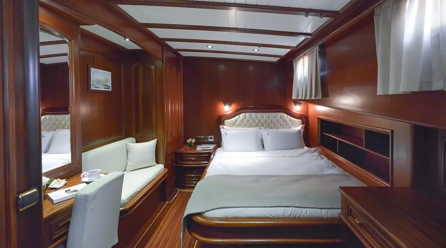 Interior of Lady Christa gulet with double cabin, wood panels, and bed