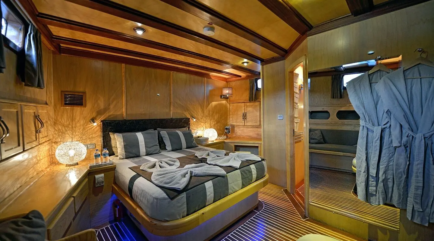 Interior of luxury gulet yacht Derin Deniz with seating area and wooden ceiling