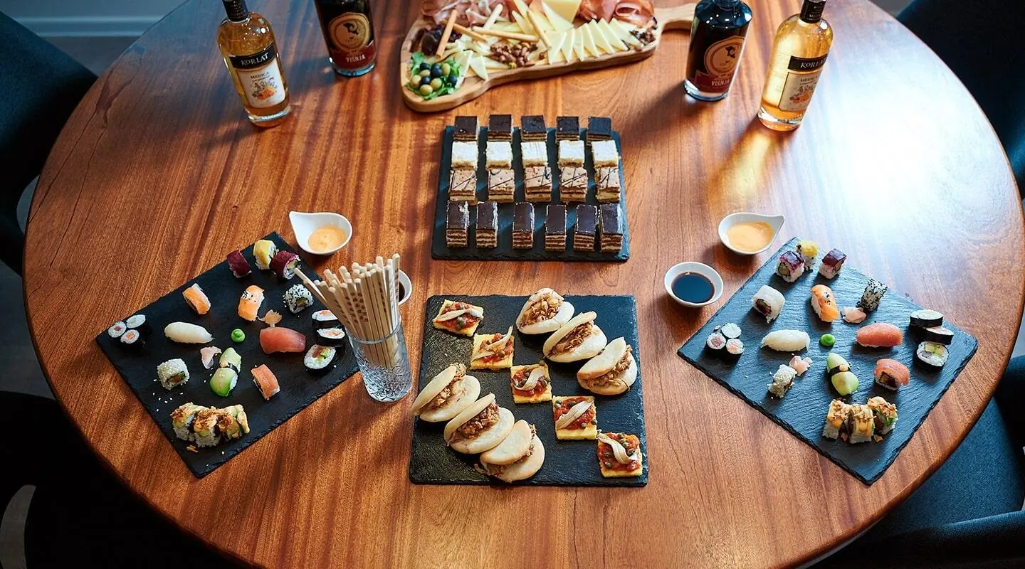 Lupus Mare yacht deck with assorted sushi platters and drinks