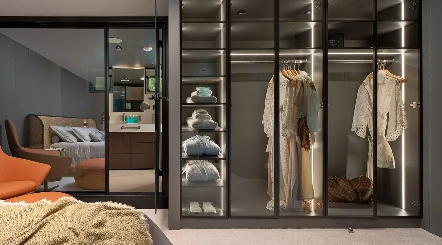 Anetta yacht master cabin closet view with hanging clothes and shelves