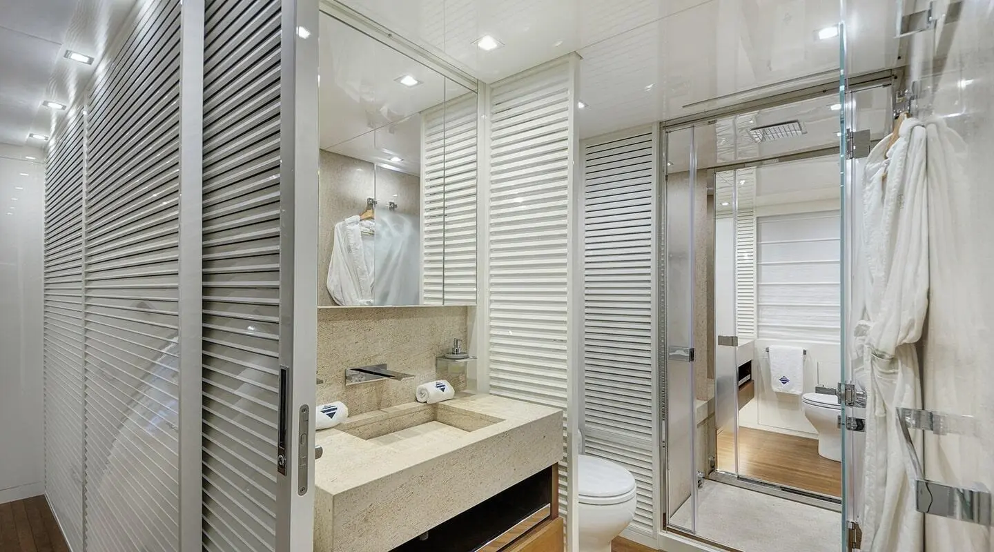 Morning Star yacht interior: modern, bright cabin with ensuite, wooden accents