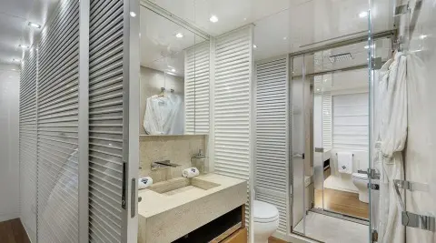 Morning Star yacht interior: modern, bright cabin with ensuite, wooden accents
