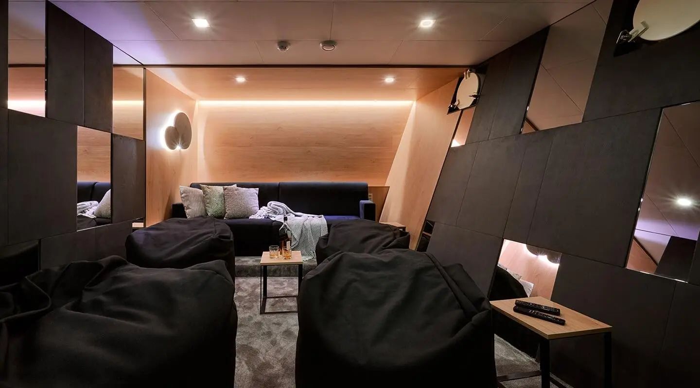 Ohana motor yacht cinema room interior with seating and screen