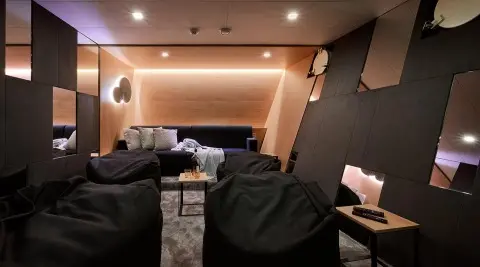 Ohana motor yacht cinema room interior with seating and screen
