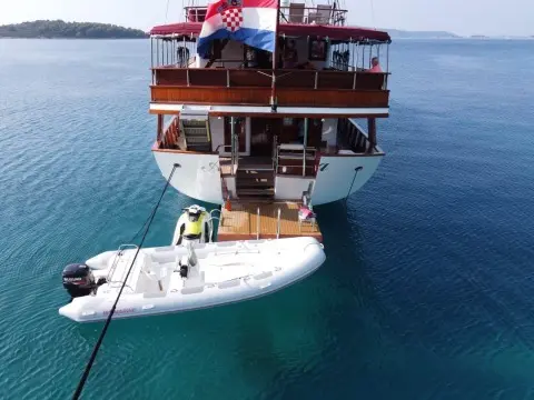 Amorena motor yacht seen from above, docked with a swim platform at stern