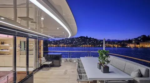 La Pellegrina 1 yacht lounge area with seating and view of night harbor
