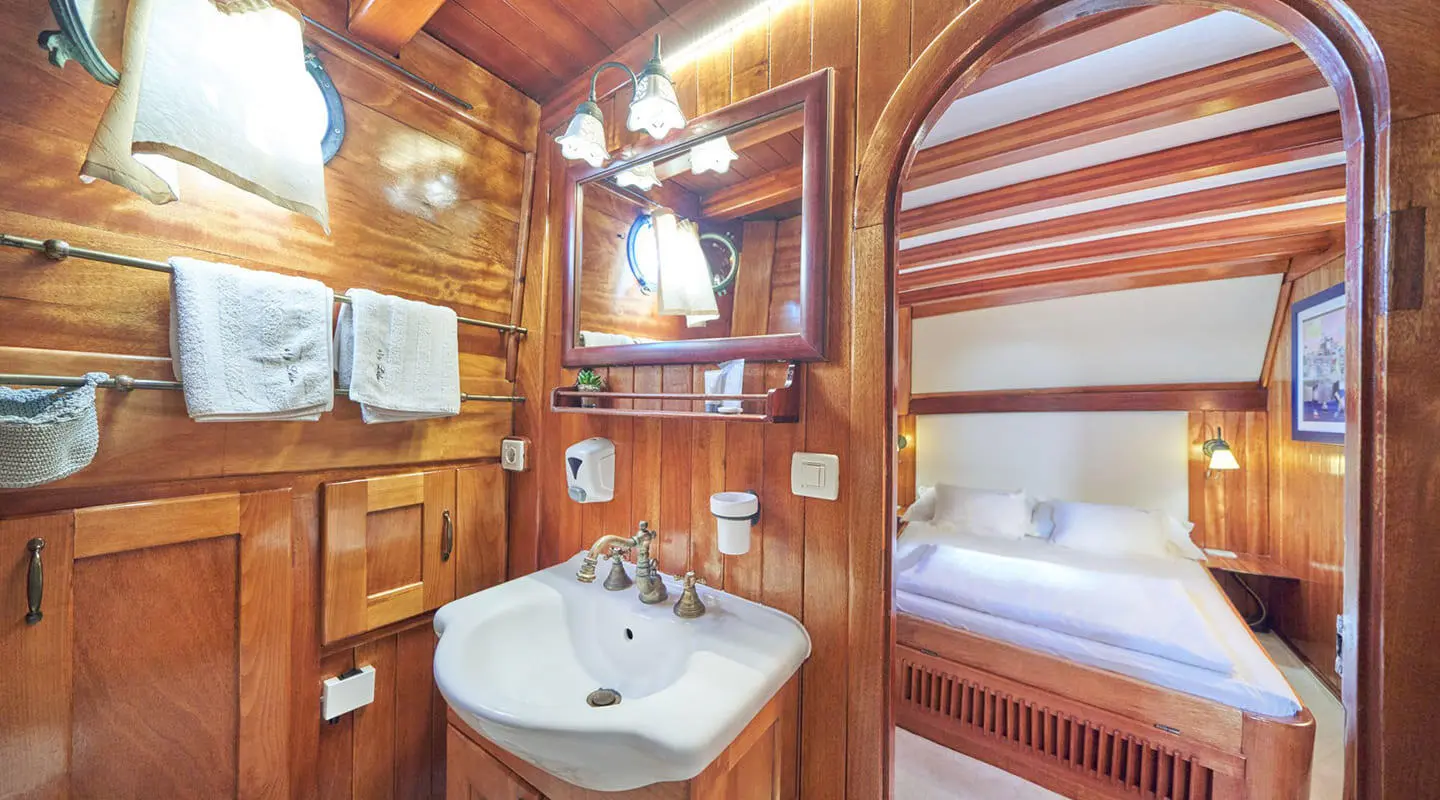 Luxurious Libra yacht at sunset with wooden cabin interior and deck view