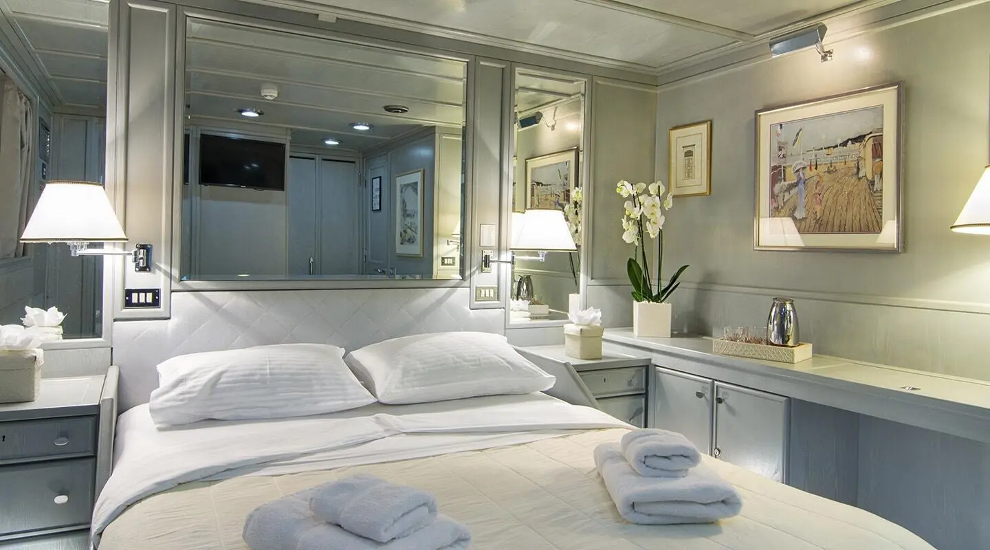 O'Natalina motor yacht interior with double cabin, neatly made beds