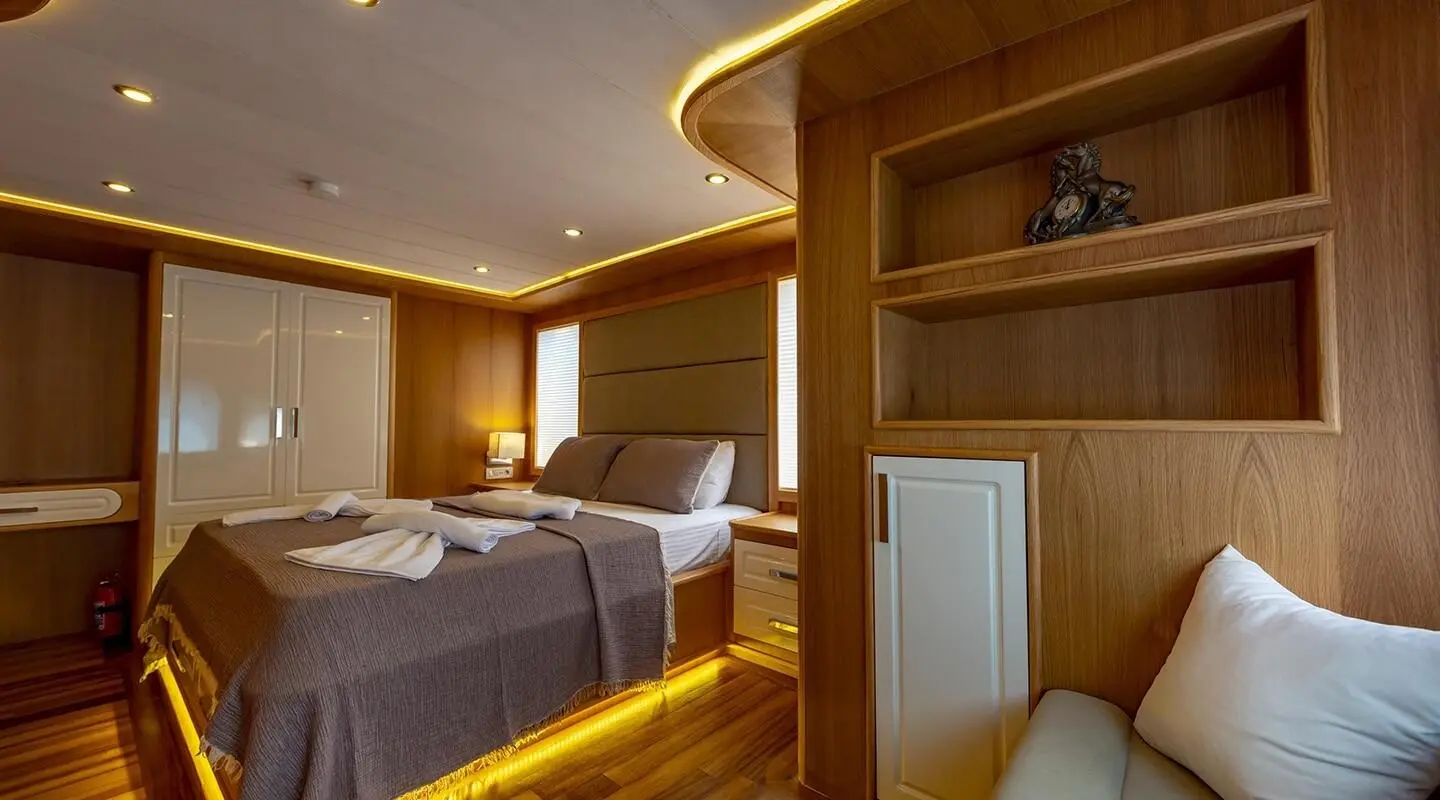 Interior of Simay M yacht with double cabin beds and wood paneling