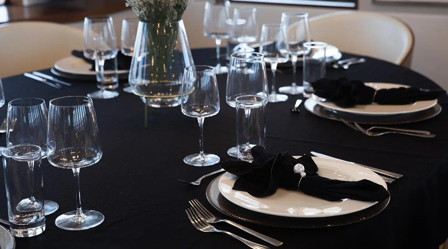 Yacht Yolo dining table set with glassware and napkins onboard