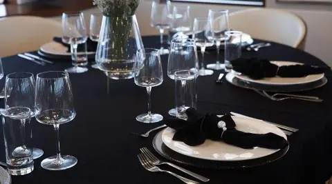 Yacht Yolo dining table set with glassware and napkins onboard