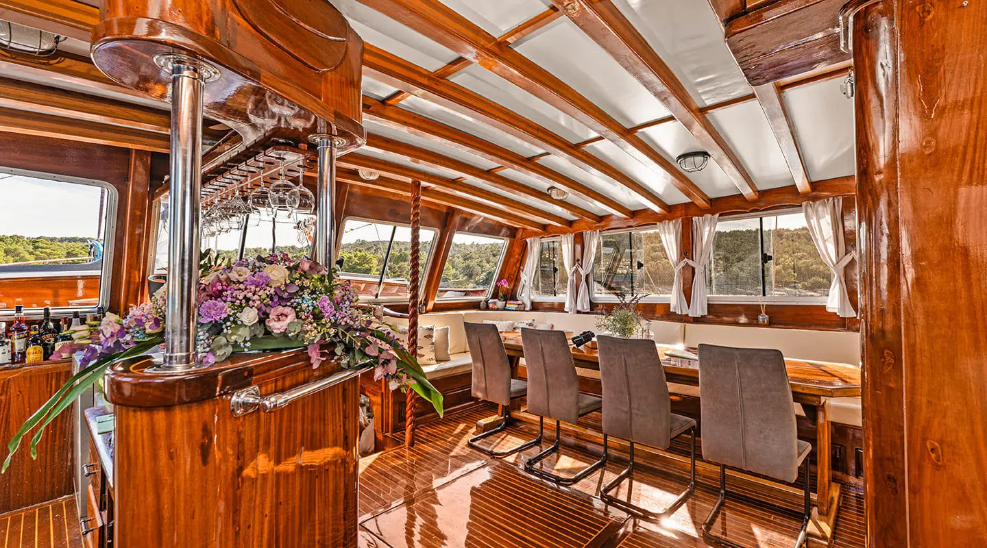 Luxurious yacht interior with polished wooden floors and seating area