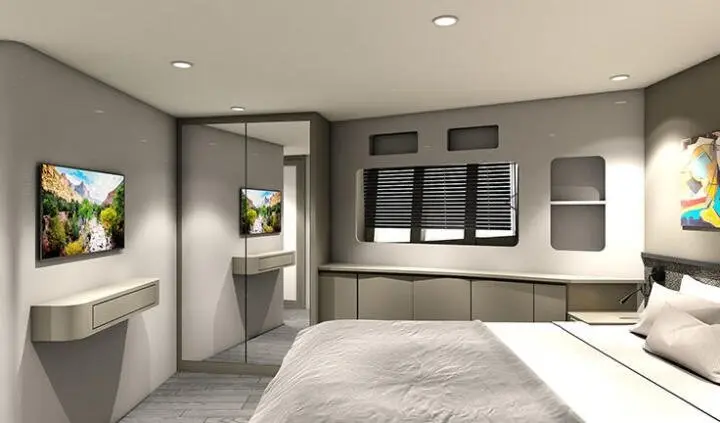 Small cabin bed with ensuite visible on a yacht interior, neutral tones