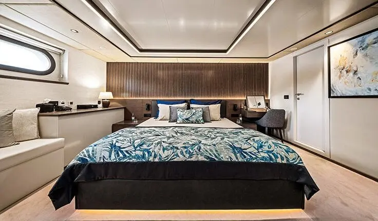 Anima Maris master cabin with king bed and ensuite, dark wood headboard