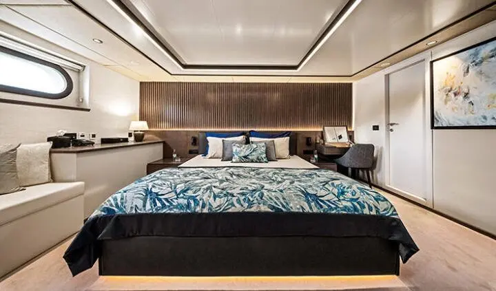 Anima Maris master cabin with king bed and ensuite, dark wood headboard