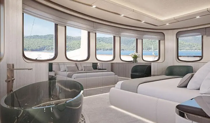 Maia yacht master cabin with king bed, white bedding, large windows, and seating area