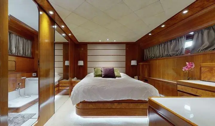 Master cabin with king bed and en-suite bathroom on Lady Natassa yacht