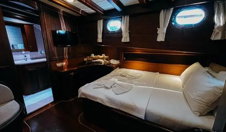 Wicked Felina master cabin with king bed, ensuite, dark wood panels