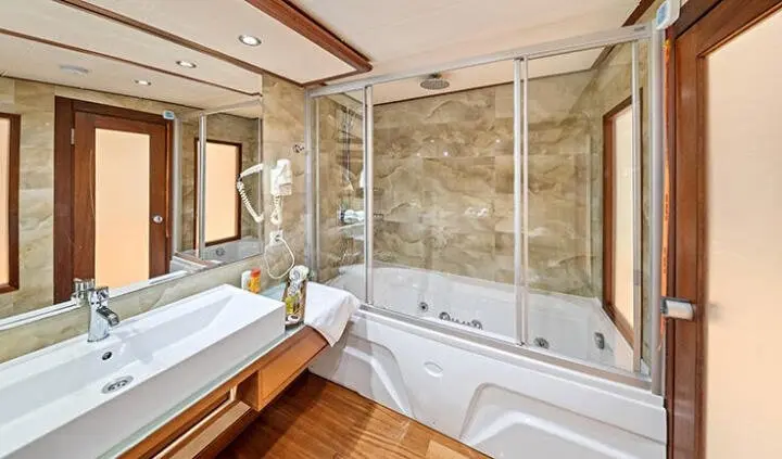 Master cabin with king bed, ensuite bath, wood accents, bright windows