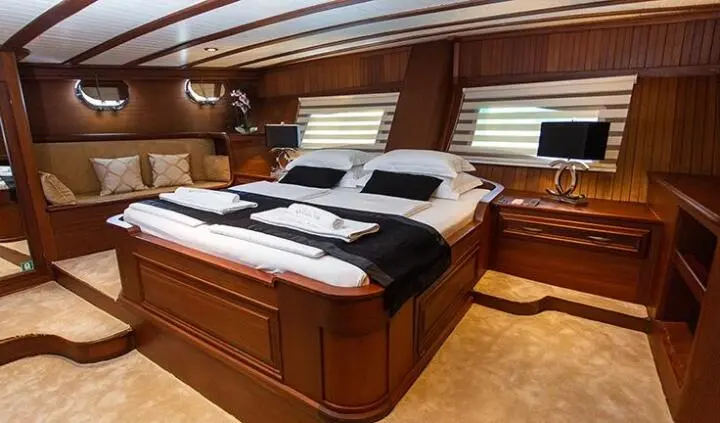 Dolce Vita master cabin with king bed and ensuite wooden paneling