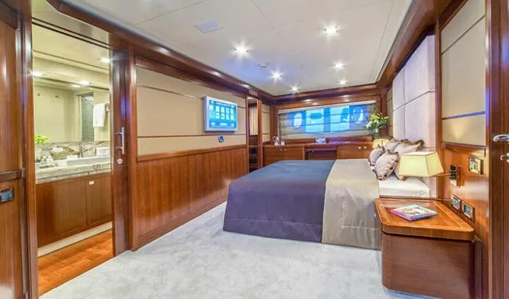 Seventh Sense master cabin with king bed, ensuite, warm wood panels