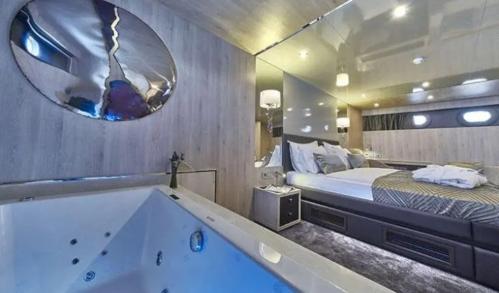 Dalmatino yacht master cabin with king bed, ensuite, and ambient lighting