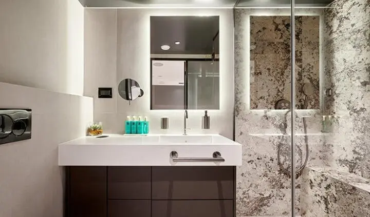 Master cabin with king bed, ensuite bathroom, modern vanity and mirror