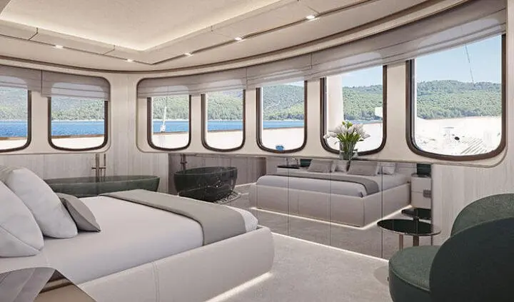Maia master cabin aboard yacht with large windows, neutral seating, and wood accents