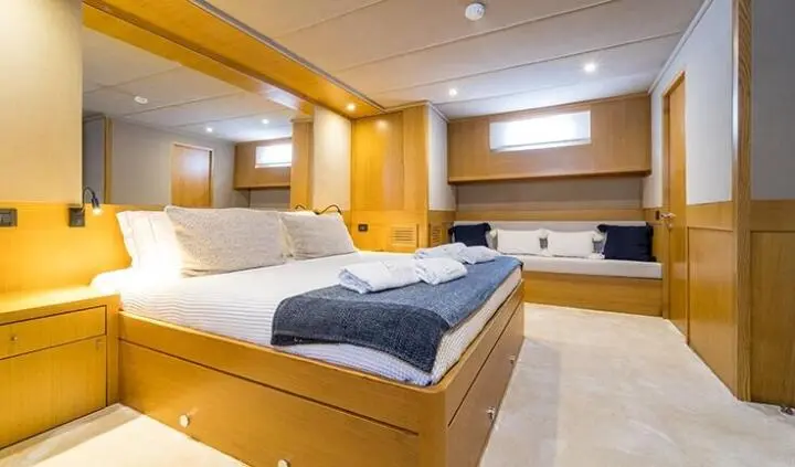 Master cabin with king bed, wood cabinetry, ensuite, soft lighting