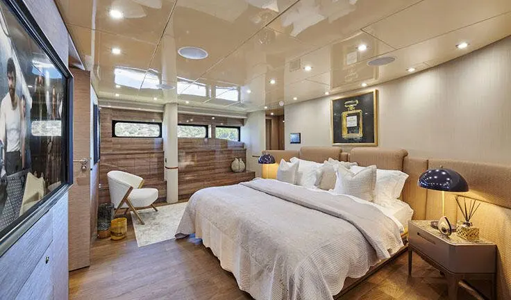 Daloli yacht master cabin with king-size bed, ensuite and soft lighting