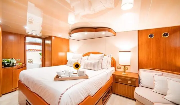 Wind Of Fortune master cabin with king bed and ensuite bathroom visible