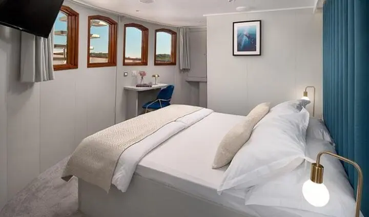 Bellezza yacht master cabin with king bed, ensuite, neutral decor