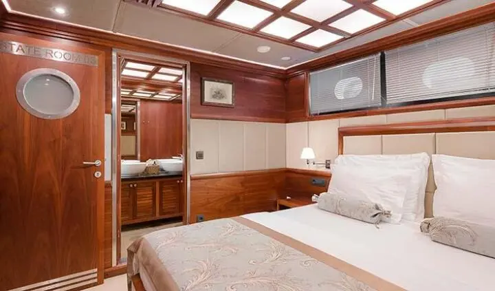 Master cabin with king bed and ensuite on Lady Gita yacht.