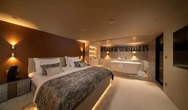 Nocturno master cabin with king bed and ensuite, warm lighting