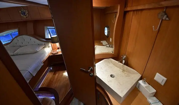 Blu Dream cabin interior with king bed, ensuite and wood paneling