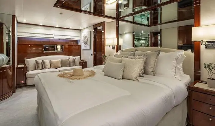 Grace cabin with king bed, white linens, and neutral pillows interior