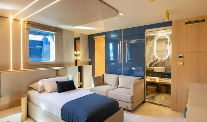Master cabin on Scorpios yacht with king bed and ensuite bathroom visible