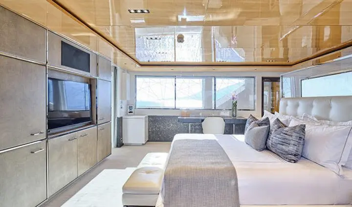 Master cabin with king bed, ensuite bathroom, large windows and neutral decor