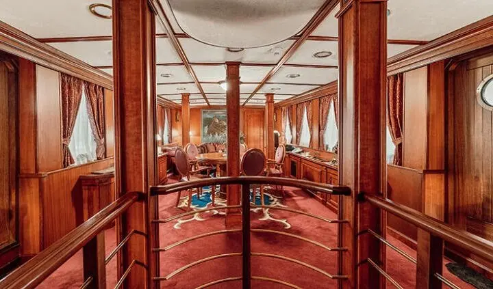Seagull II master cabin with king bed and ensuite visible through doorway