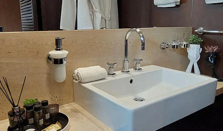 Miraval yacht cabin with king bed, ensuite view of sink and countertop