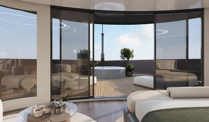 Master cabin with king bed and ensuite view of outdoor deck through large windows