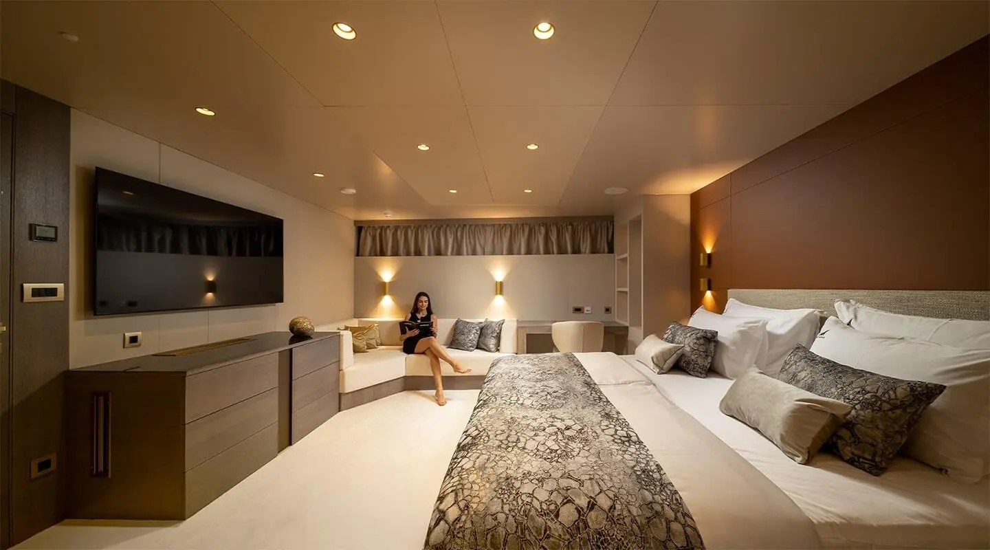 Interior of Nocturno luxury yacht showroom-style lounge with seating and rug
