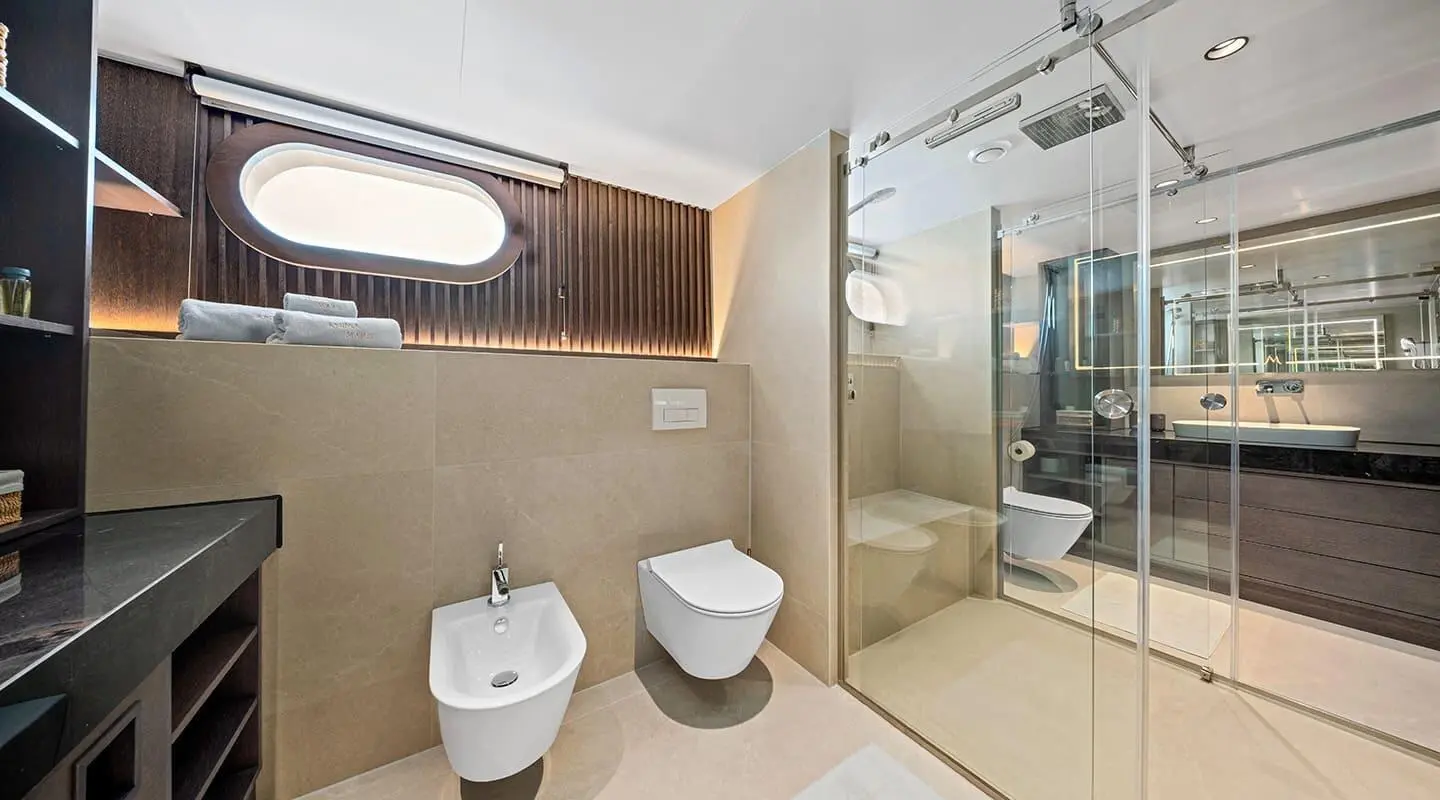 Anima Maris master bathroom with toilet, bidet, and sink area