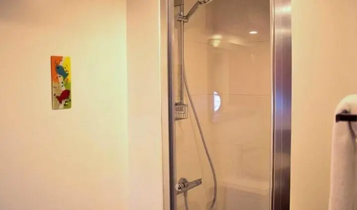 Master cabin with king bed and ensuite visible on yacht Virtuoso
