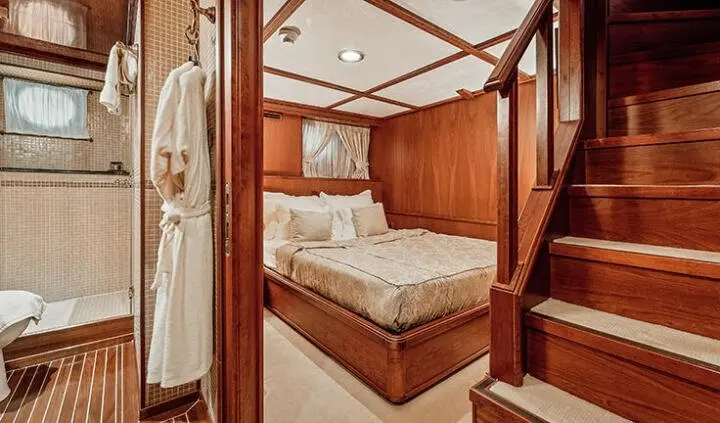 Seagull II cabin with king bed, wood paneling, and built-in storage
