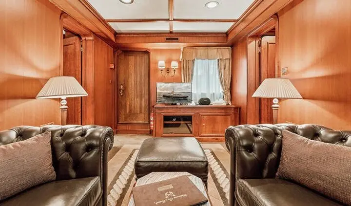 Seagull II master cabin with king bed and ensuite, wood paneling and seating