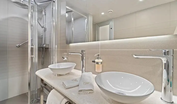 Master cabin with king bed, ensuite bathroom, modern fixtures and neutral tones
