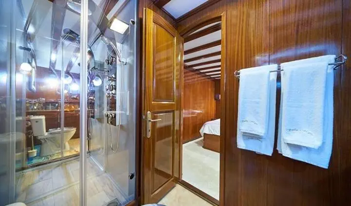 Stella Maris master cabin with king bed and adjoining ensuite visible